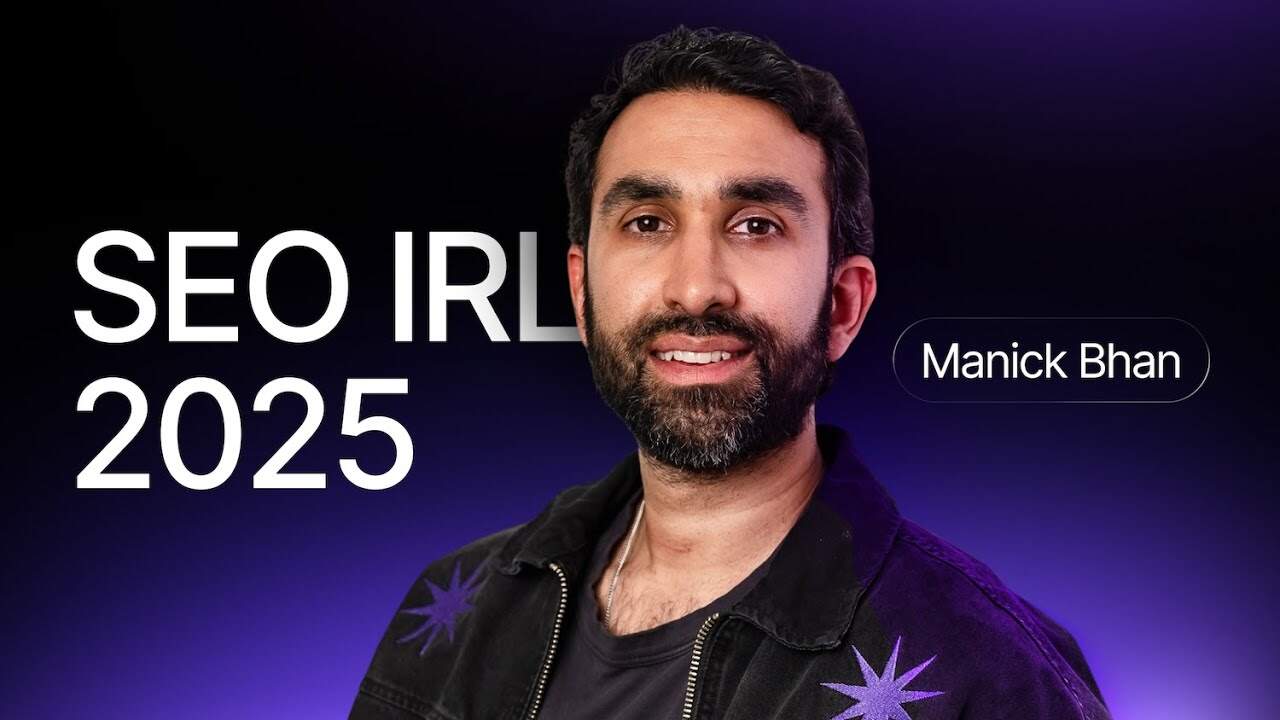 Manick Bhan speaking at SEO IRL 2025 conference about online business success.