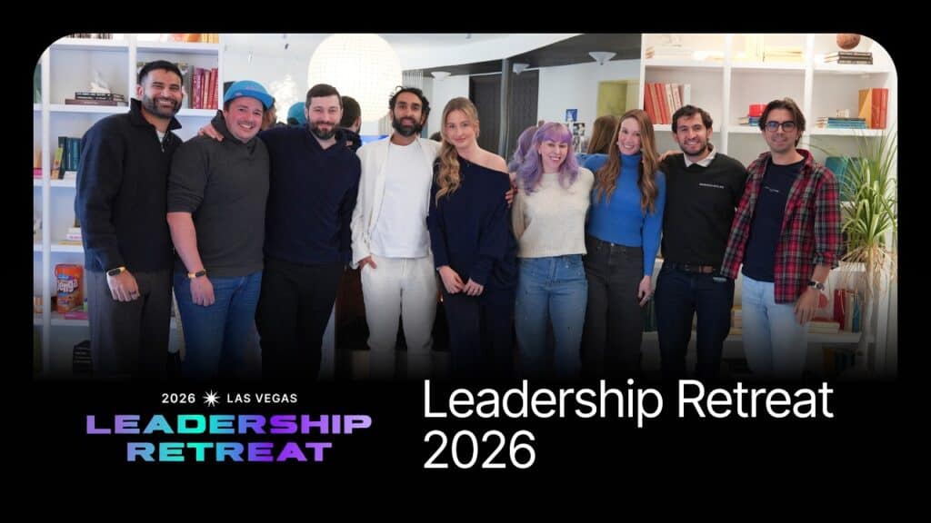 Group of diverse professionals at leadership retreat in a modern office setting.